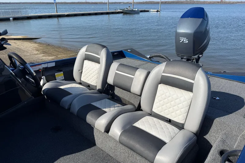 Slide: The Image of 2020 Triton 17 TX boat interior with Yamaha 75 engine by the water. - 19