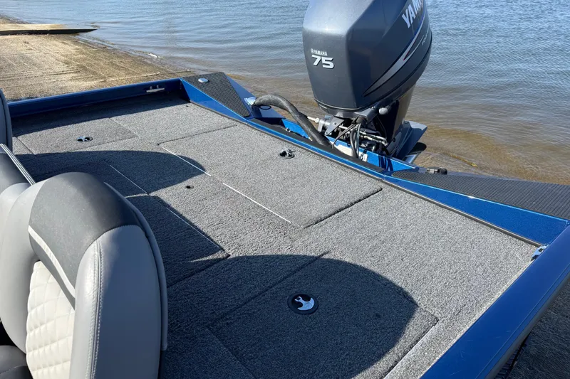 Slide: The Image of 2020 Triton 17 TX boat with Yamaha 75 engine at a lakeside dock. - 20