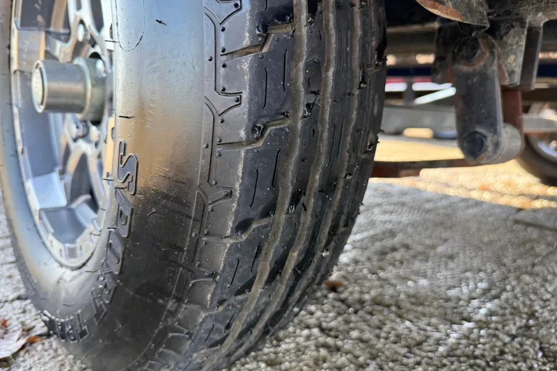 Slide: The Image of Close-up of a 2020 Triton 17 TX tire showing tread and wheel detail. - 21