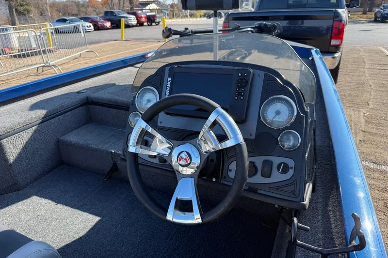 Slide: The Image of Steering console of a 2020 Triton 17 TX boat with modern controls and gauges. - 27