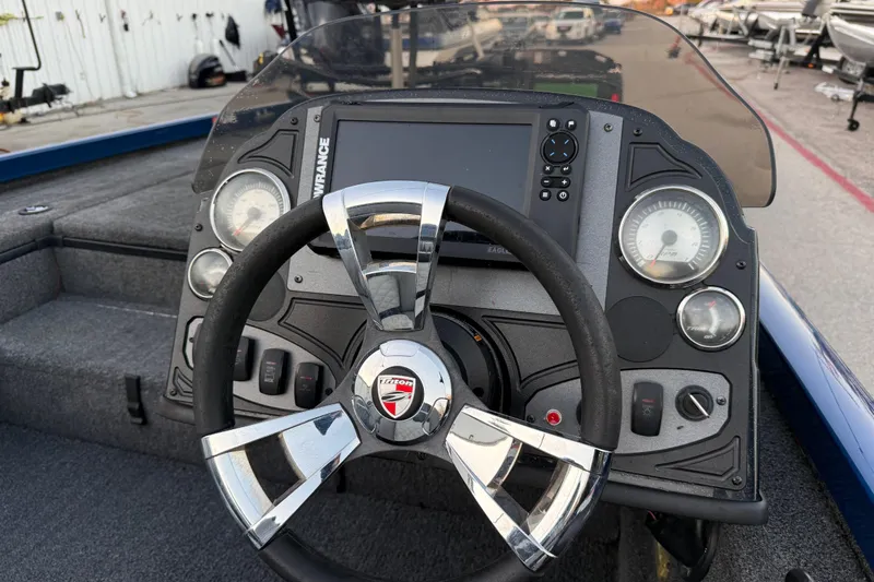 Slide: The Image of Steering console of 2020 Triton 17 TX boat with gauges and controls. - 34