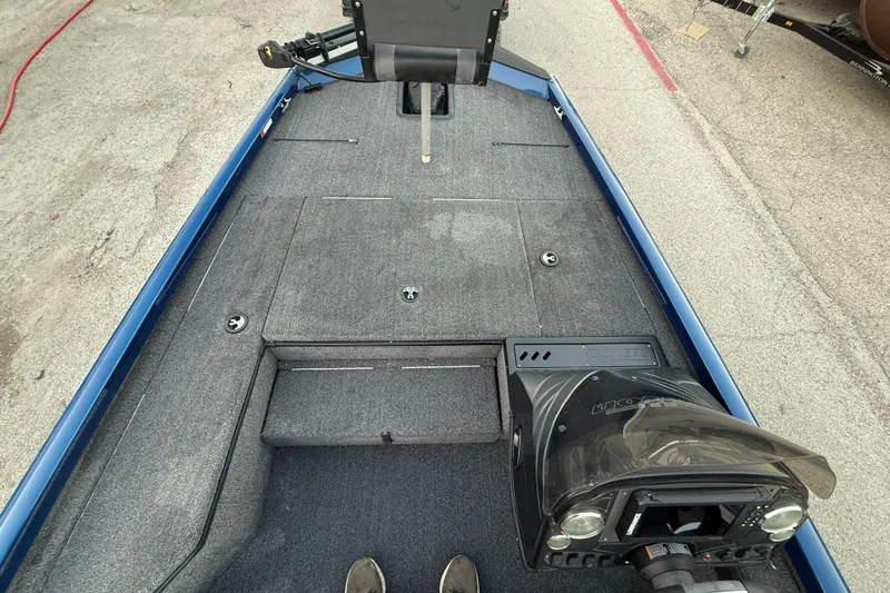 Slide: The Image of 2020 Triton 17 TX boat interior with gray carpet and control panel. - 40