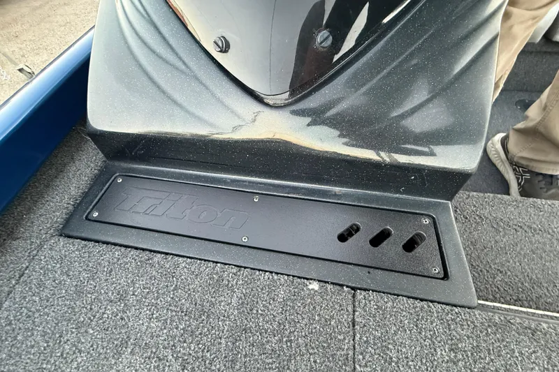 Slide: The Image of 2020 Triton 17 TX boat deck with logo and textured surface. - 44