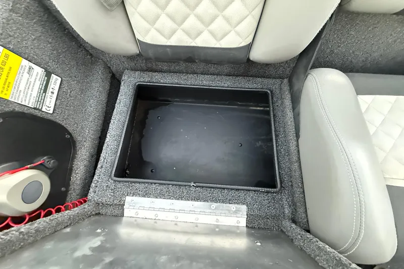 Slide: The Image of Interior of 2020 Triton 17 TX boat showing storage compartment and seating. - 45