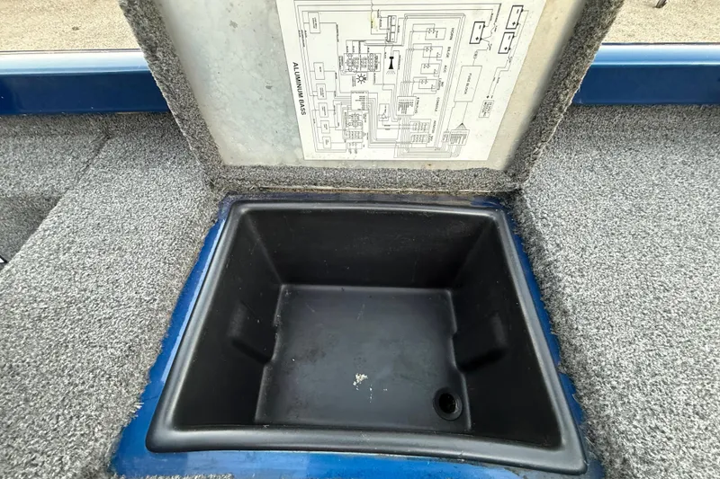 Slide: The Image of Open storage compartment in 2020 Triton 17 TX boat with wiring diagram. - 51