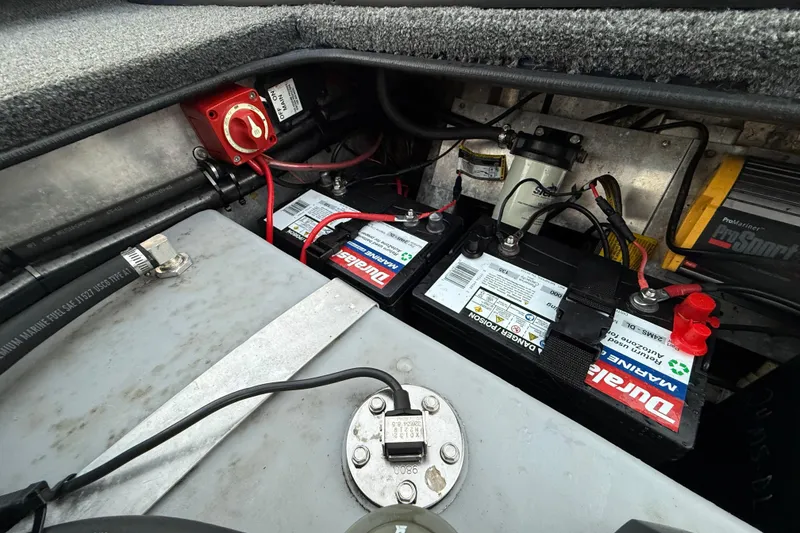 Slide: The Image of Battery compartment of a 2020 Triton 17 TX boat with dual marine batteries. - 54