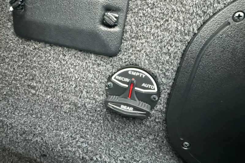 Slide: The Image of Control dial on 2020 Triton 17 TX boat interior, featuring options for empty, recirculate, and auto. - 56