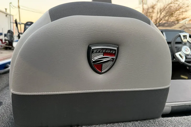 Slide: The Image of Triton 17 TX 2020 boat seat with logo, featuring gray upholstery and sleek design. - 58