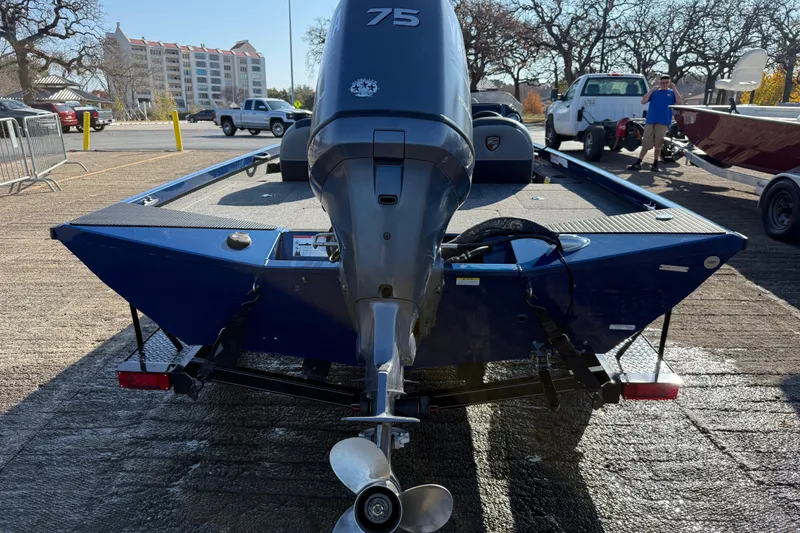 Slide: The Image of 2020 Triton 17 TX boat with 75 HP engine on trailer in parking lot. - 8