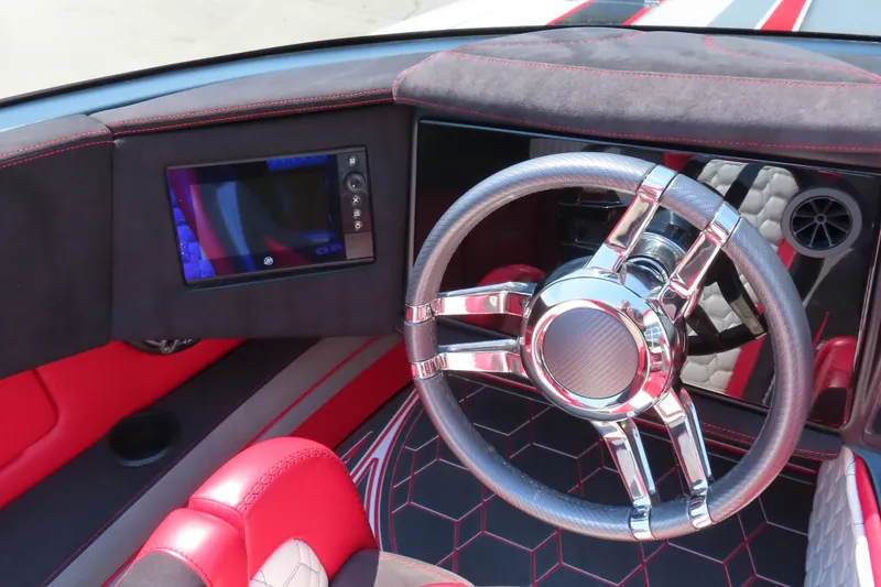 Slide: The Image of Interior of 2018 Wright Performance 360 boat with sleek steering wheel and modern dashboard. - 12