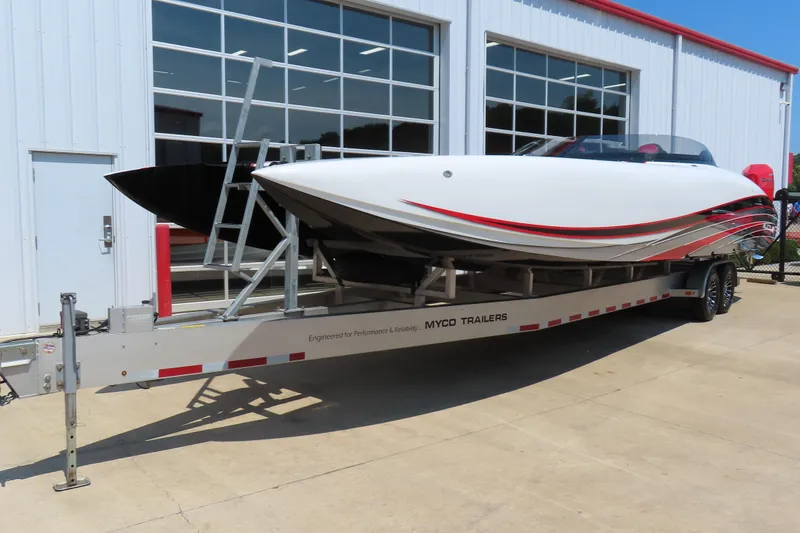 Slide: The Image of 2018 Wright Performance 360 boat on trailer, parked outside a building. - 2