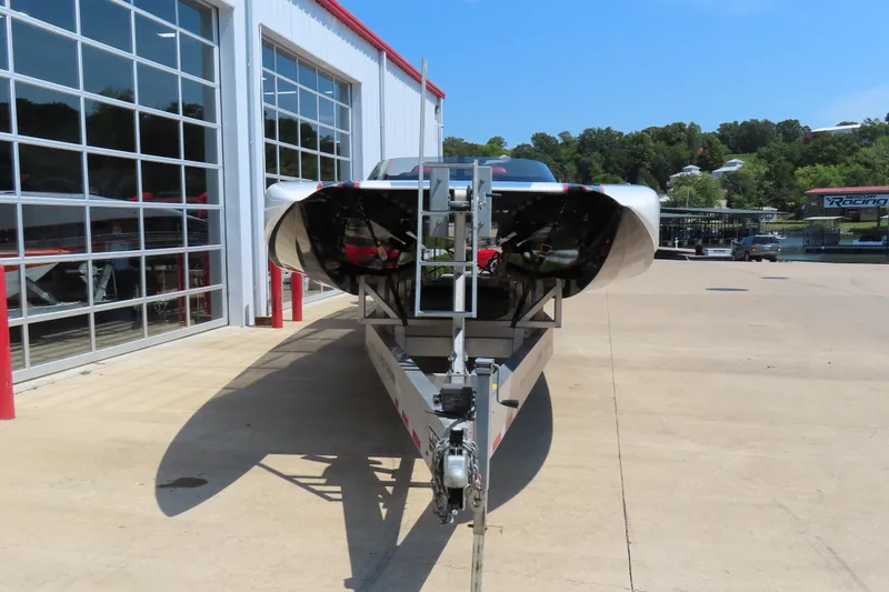 Slide: The Image of 2018 Wright Performance 360 boat on trailer outside a garage, sunny day. - 3