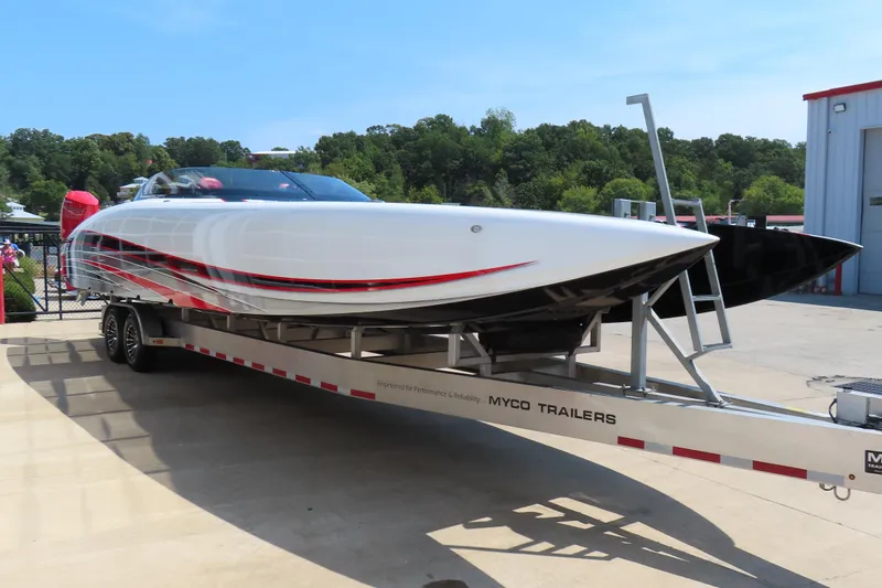 Slide: The Image of 2018 Wright Performance 360 boat on Myco trailer, sleek design with red accents. - 4