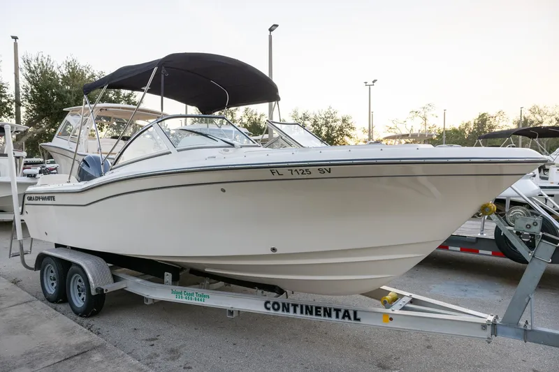 Slide: The Image of 2021 Grady-White Freedom 215 boat on trailer, parked outdoors. - 15