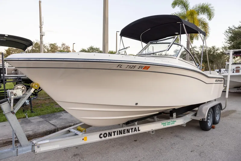 Slide: The Image of 2021 Grady-White Freedom 215 boat on trailer, parked outdoors. - 16