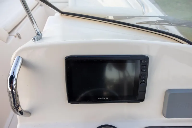 Slide: The Image of Garmin display on 2021 Grady-White Freedom 215 boat dashboard. - 9