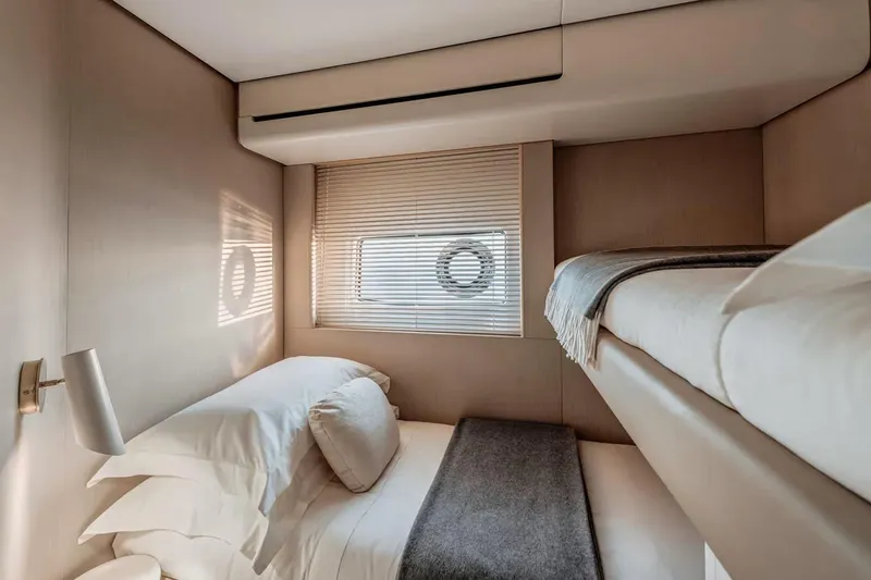 Slide: The Image of Manufacturer Provided Image: Luxurious cabin interior of 2025 Azimut Fly 68 yacht with bunk beds and elegant decor. - 15