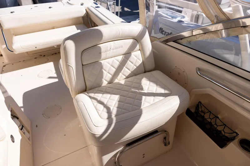 Slide: The Image of 2022 Grady-White Freedom 275 boat interior with luxurious seating and elegant design. - 14