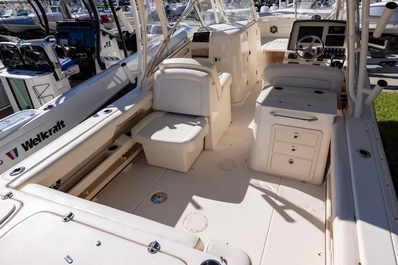 Slide: The Image of 2022 Grady-White Freedom 275 boat interior with seating and control panel. - 4