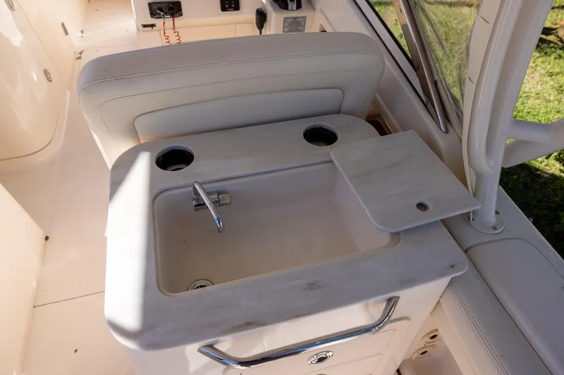 Slide: The Image of Grady-White Freedom 275 boat interior sink and seating, 2022 model. - 5