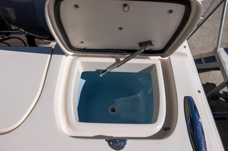 Slide: The Image of Open storage compartment on 2022 Grady-White Freedom 275 boat. - 9