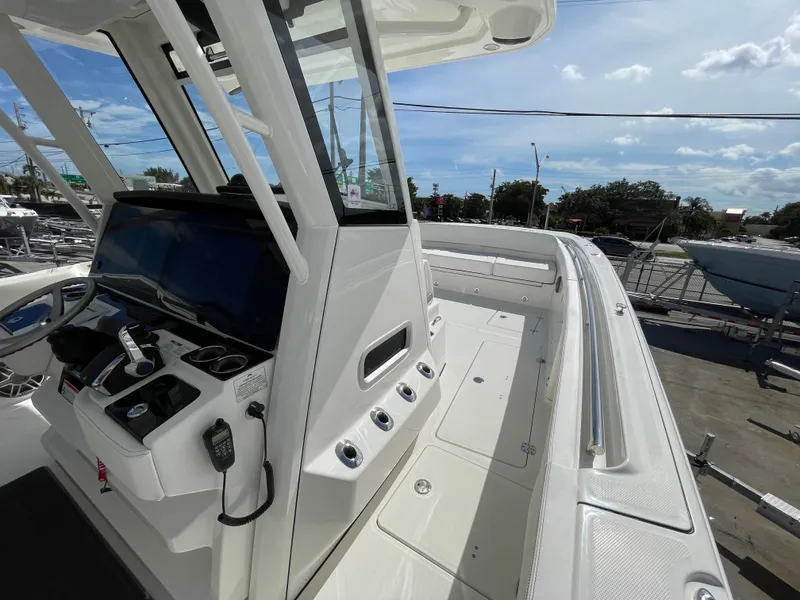Slide: The Image of 2024 World Cat 400 CC-X boat cockpit with modern controls and spacious deck. - 10