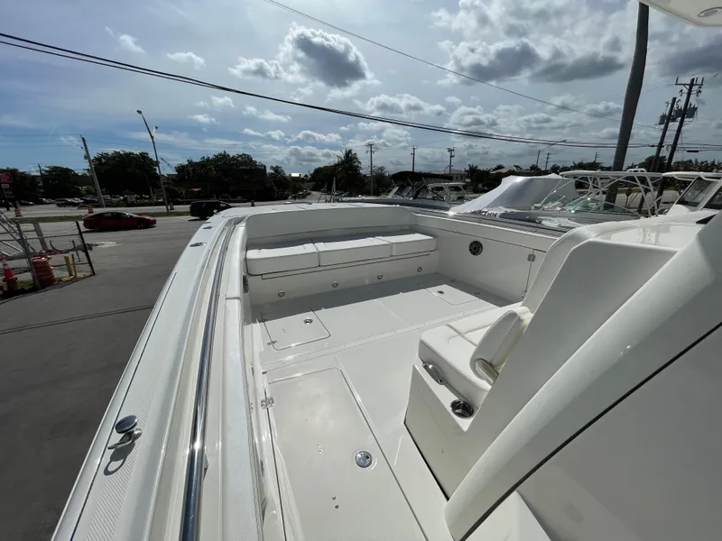 Slide: The Image of 2024 World Cat 400 CC-X boat deck with seating and storage compartments. - 11