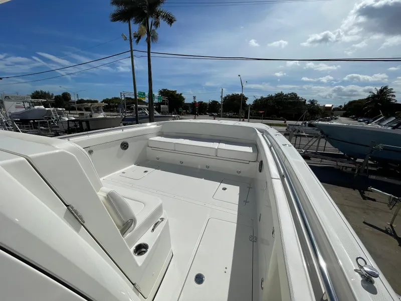 Slide: The Image of 2024 World Cat 400 CC-X boat deck with seating and storage compartments. - 13