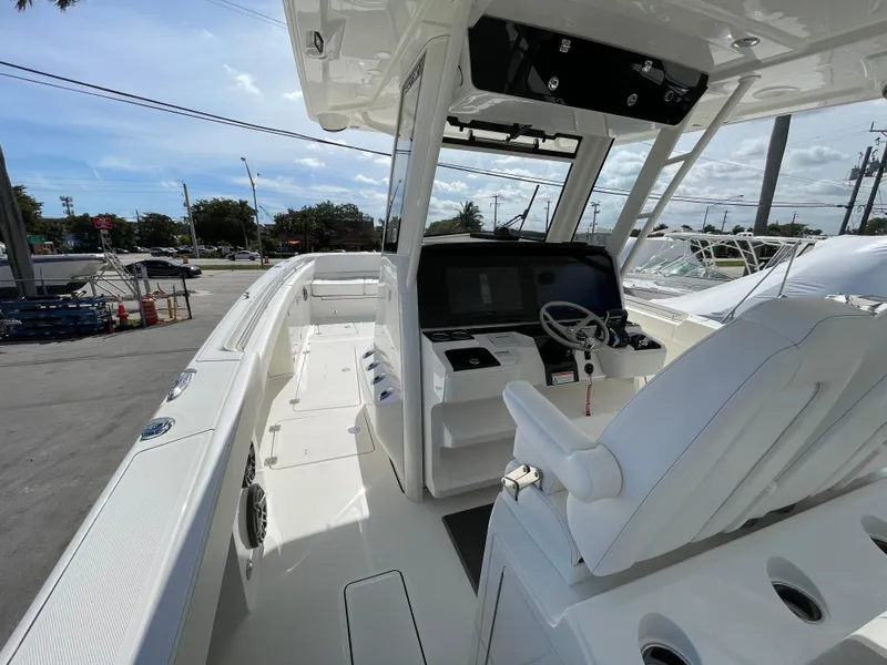 Slide: The Image of 2024 World Cat 400 CC-X boat interior with helm station and seating. - 6