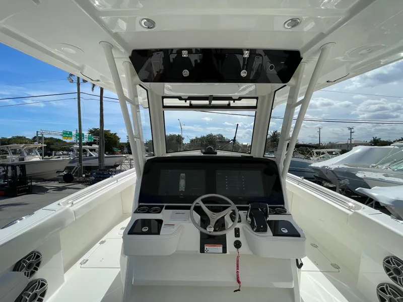 Slide: The Image of 2024 World Cat 400 CC-X boat helm with modern controls and navigation screens. - 7