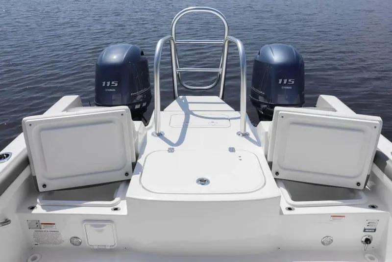 Slide: The Image of Manufacturer Provided Image: 2025 World Cat 230 DC boat with dual Yamaha 115 engines on calm water. - 6