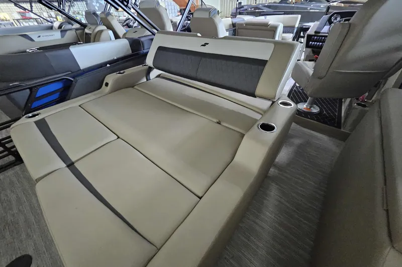 Slide: The Image of 2026 Starcraft SLS 3 Q DH boat interior with luxurious seating and cup holders. - 12