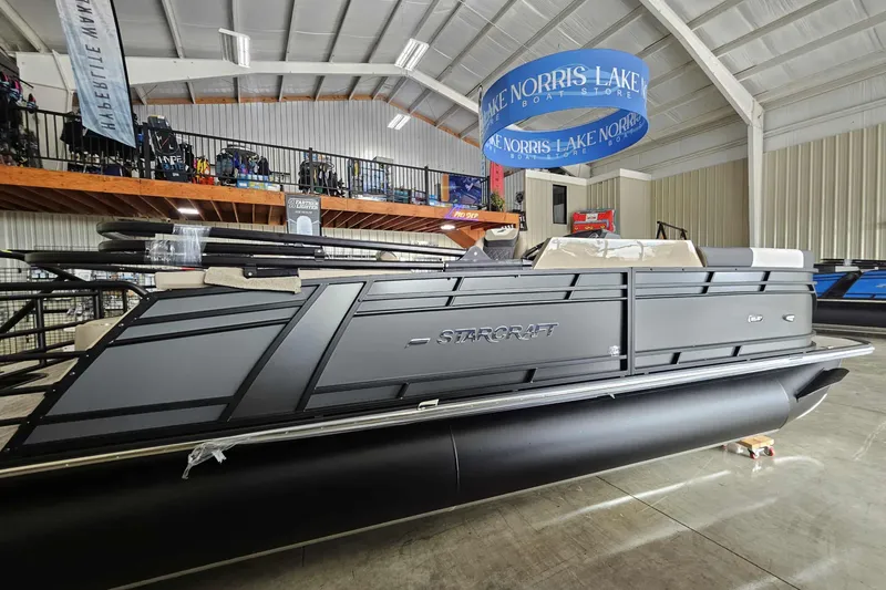 Slide: The Image of 2026 Starcraft SLS 3 Q DH pontoon boat displayed indoors at Norris Lake Boat Store. - 3