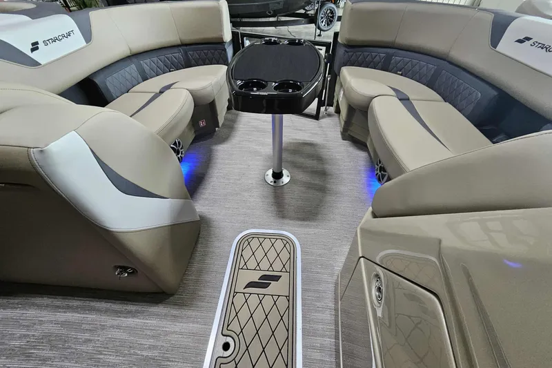 Slide: The Image of Luxurious interior of 2026 Starcraft SLS 3 Q DH boat with elegant seating and table. - 5
