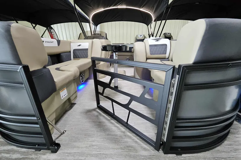 Slide: The Image of Interior of 2026 Starcraft SLS 3 Q DH pontoon boat with luxurious seating and modern design. - 7