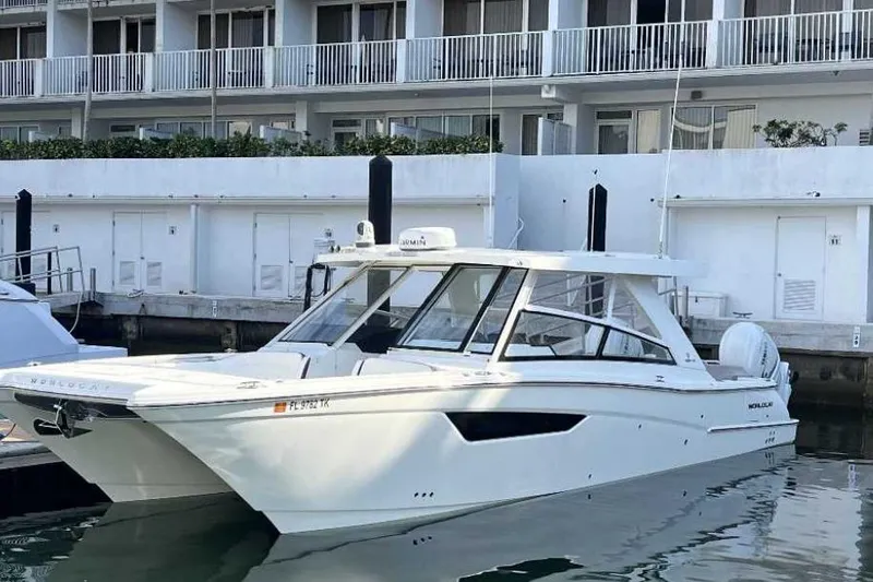 The Image of 2023 World Cat 400 DC-X boat docked at marina, modern design. - 0