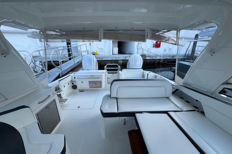 Slide: The Image of Interior view of 2023 World Cat 400 DC-X boat, featuring spacious seating and modern amenities. - 12