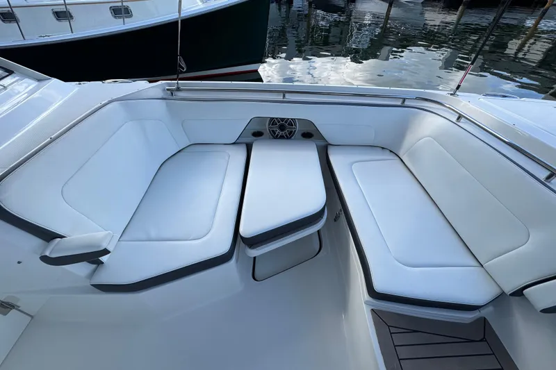 Slide: The Image of Luxurious seating area on 2023 World Cat 400 DC-X boat, docked by the water. - 13
