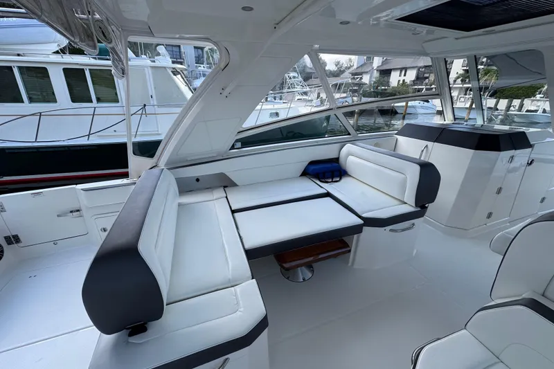 Slide: The Image of Luxurious interior of 2023 World Cat 400 DC-X boat with white seating and modern design. - 14