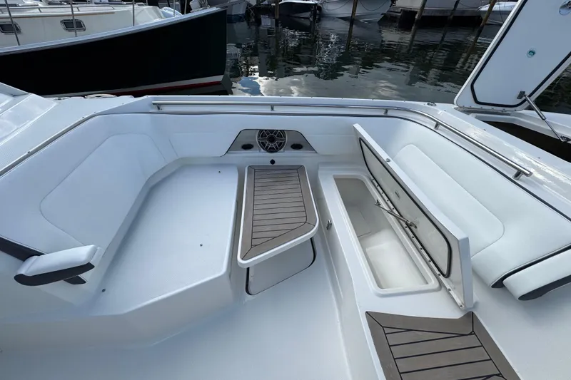 Slide: The Image of 2023 World Cat 400 DC-X boat interior with seating and storage compartments. - 18