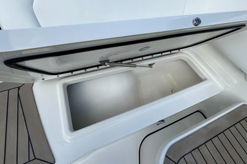 Slide: The Image of Open storage compartment on 2023 World Cat 400 DC-X boat, featuring sleek design and spacious interior. - 21