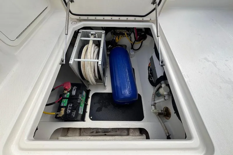 Slide: The Image of 2023 World Cat 400 DC-X boat storage compartment with batteries and equipment. - 29