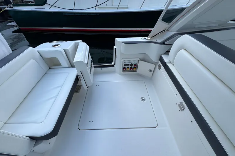 Slide: The Image of 2023 World Cat 400 DC-X boat interior with white seating and control panel. - 31