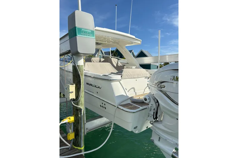 Slide: The Image of 2023 World Cat 400 DC-X boat docked, featuring Yamaha XTO engine, under clear blue sky. - 36
