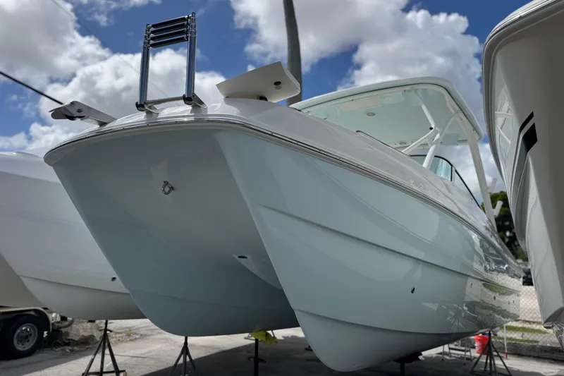 The Image of 2026 World Cat 230 SD boat on display under a cloudy sky. - 0