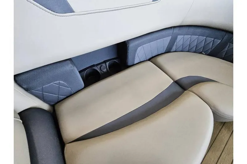 Slide: The Image of 2024 Starcraft CX 23 RL boat interior seating with cup holders, featuring elegant design. - 6