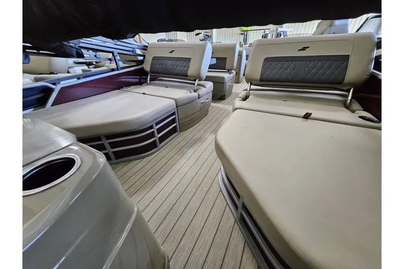 Slide: The Image of 2024 Starcraft CX 23 RL pontoon boat interior with luxurious seating and modern design. - 8