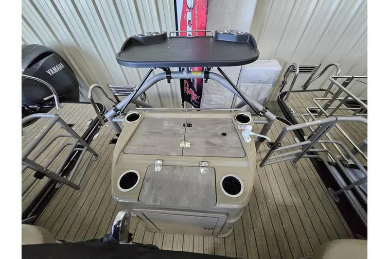 Slide: The Image of 2024 Starcraft CX 23 RL boat interior with seating and storage compartments. - 9