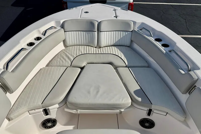 Slide: The Image of 2023 Sea Fox 228 Commander boat with cushioned seating and cup holders. - 10