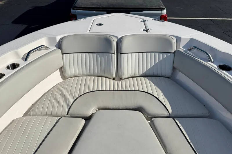 Slide: The Image of 2023 Sea Fox 228 Commander boat interior with cushioned seating and cup holders. - 11